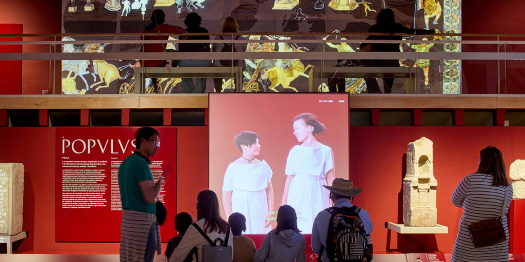 Families enjoying the Imerivum exhibition at the MAC.